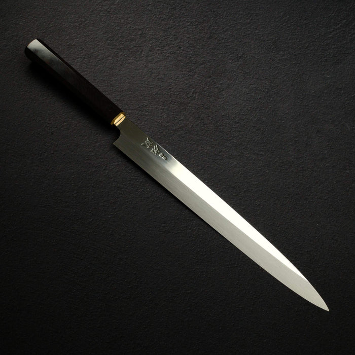 Left: Nigara Blue 2 honyaki, with the wavy hamon running along the middle of the blade. Right: Sukenari SG2, sold as Honyaki: one even finish, and the straight line is the bevel (shinogi), not a hamon.
