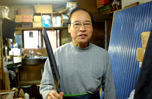 Hirotsugu Tosa holding a Sakai Takayuki Hien from the K&S Special Hien run he sharpened