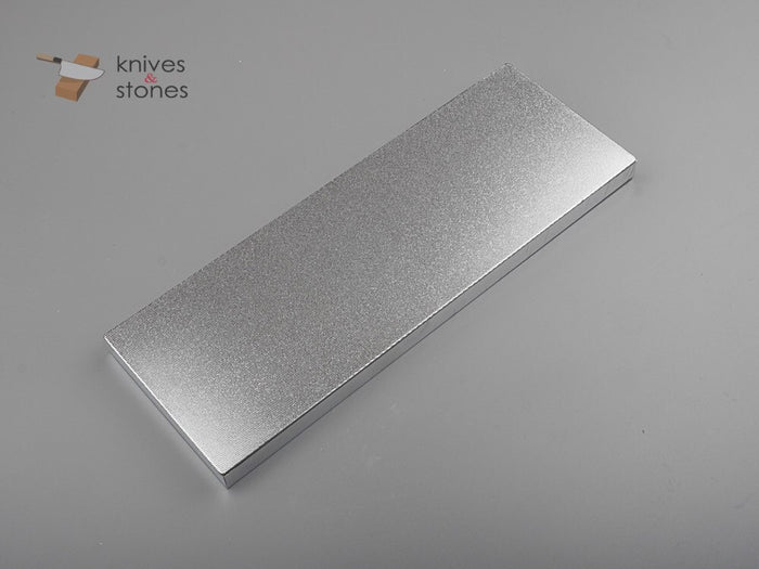 The two kinds we sell for the job: an Atoma diamond plate (400 grit) and the Suehiro ceramic flattening stone.