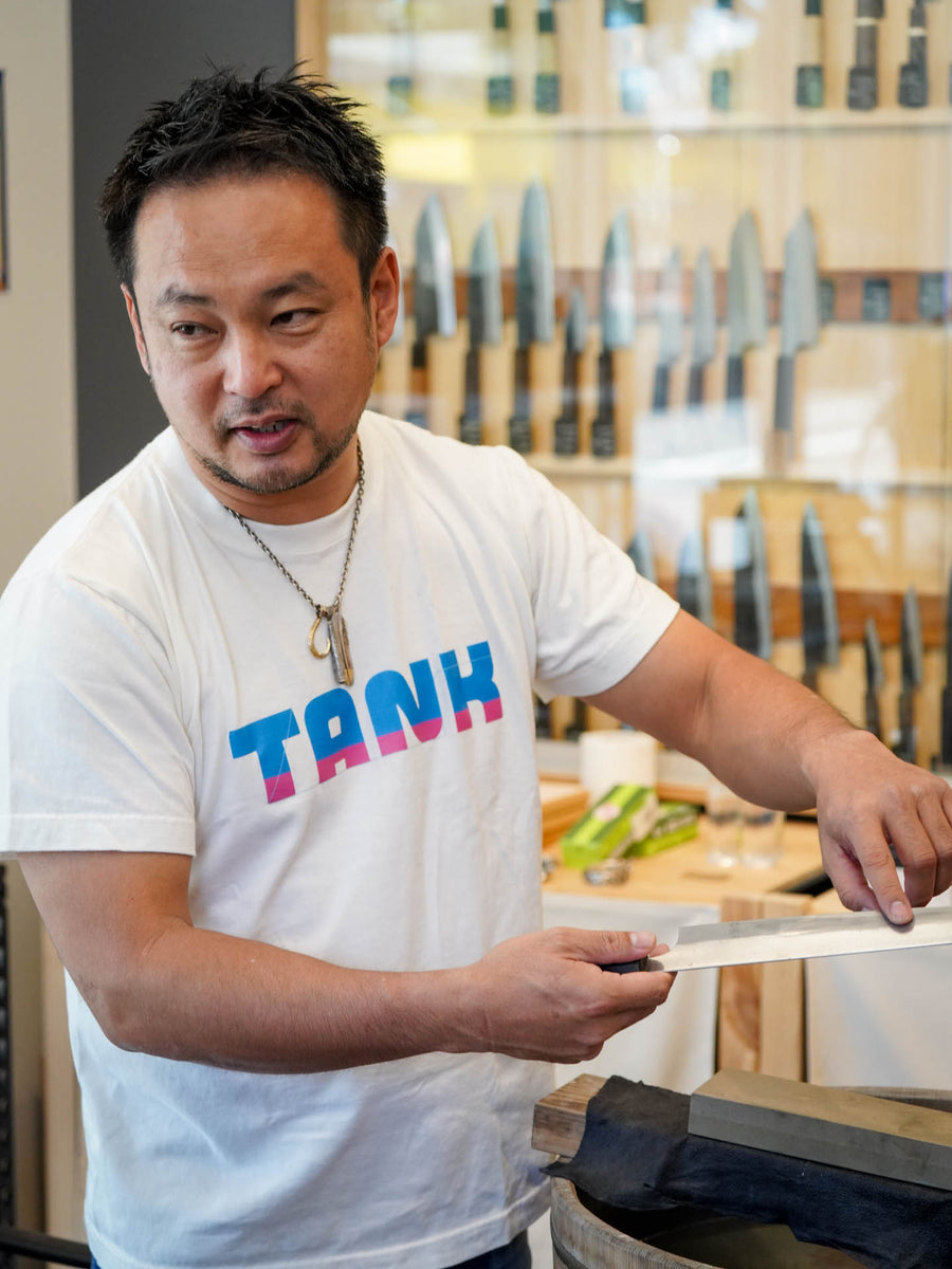 Shibata-san demonstrating a blade edge at the Knives & Stones Sydney store
